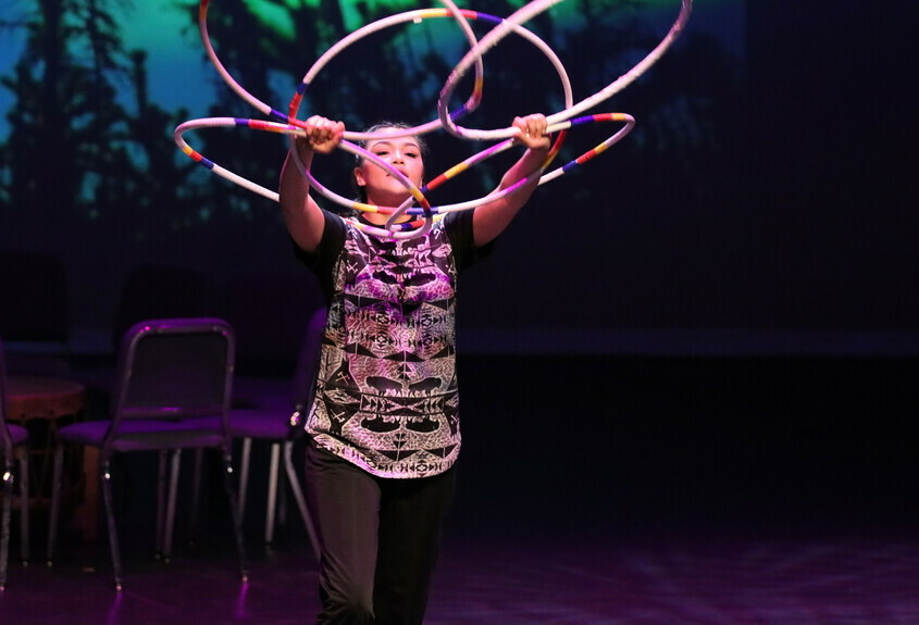 Student performing a hoop dance